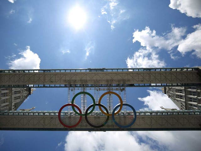 Giant Olympic rings became the crowning glory on Tower Bridge today to mark the countdown to the London 2012 Games