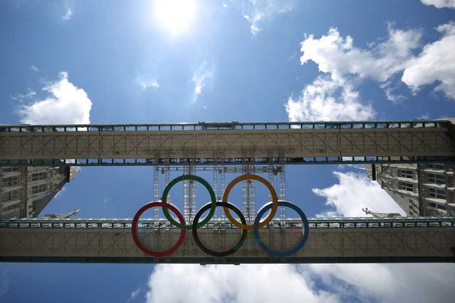 Giant Olympic rings became the crowning glory on Tower Bridge today to mark the countdown to the London 2012 Games