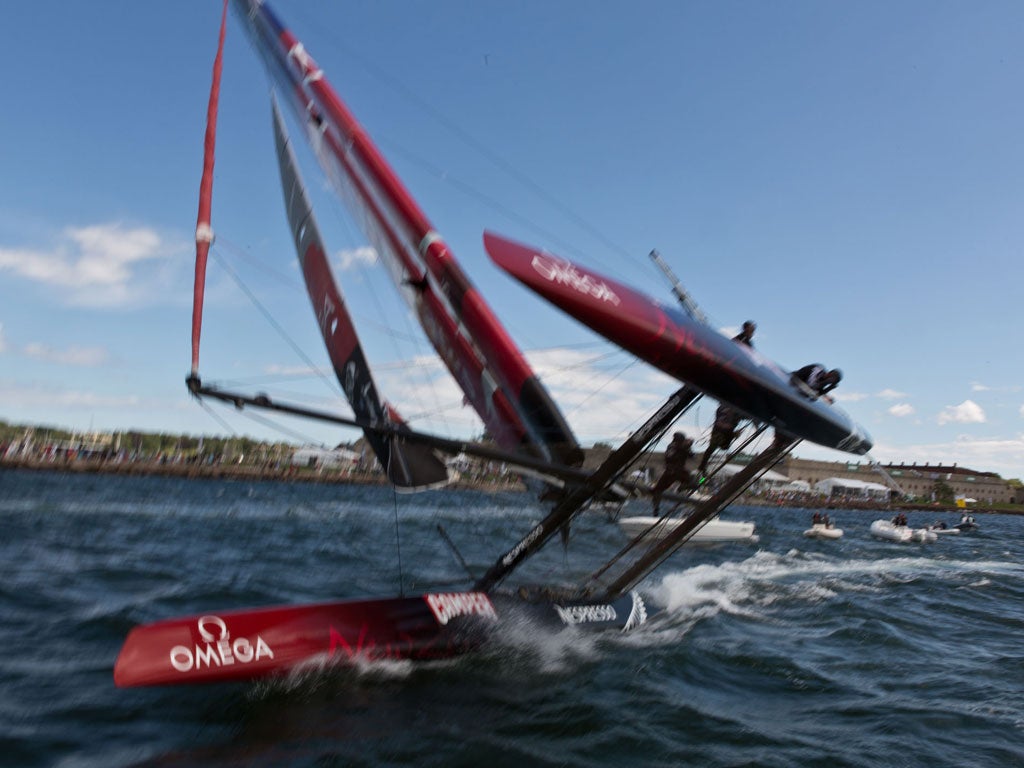 If it looks a little blurred it is because photographer Gilles Martin-Raget was ducking as he took the flying image of Team New Zealand's 45-foot catamaran just before it collided with the boat on which he was standing
