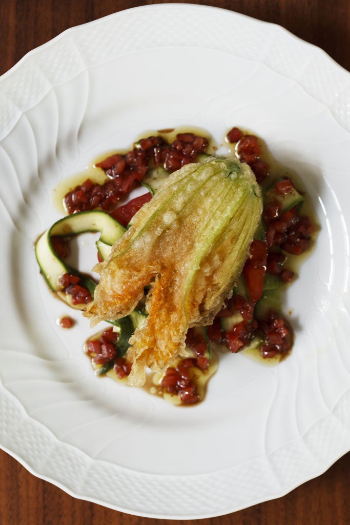 Deep-fried courgette flowers with oxheart tomatoes and shaved courgettes