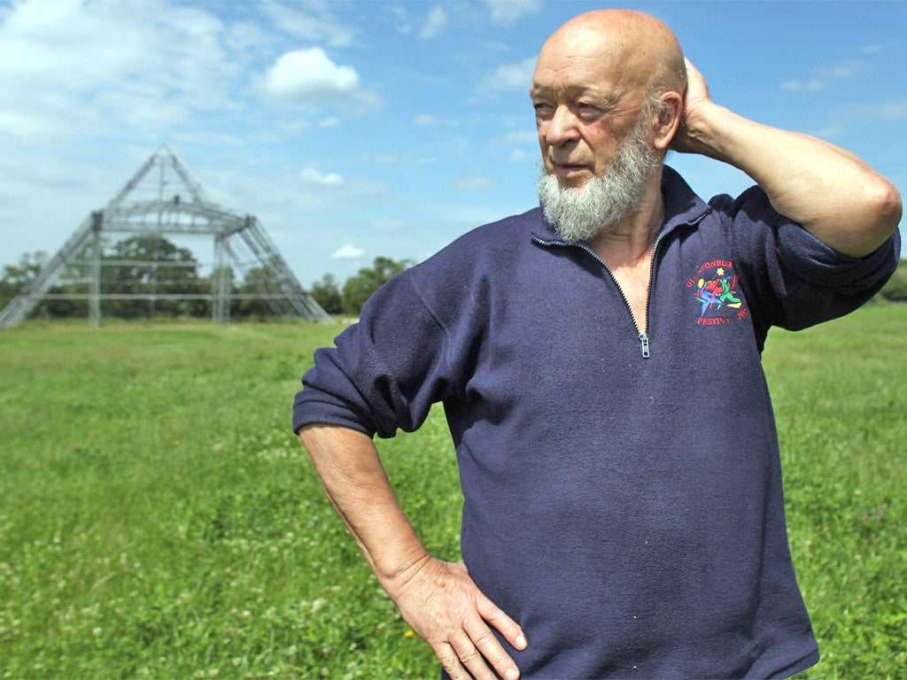 Glastonbury Festival founder Michael Eavis at Worthy Farm with the skeleton of the main Pyramid Stage