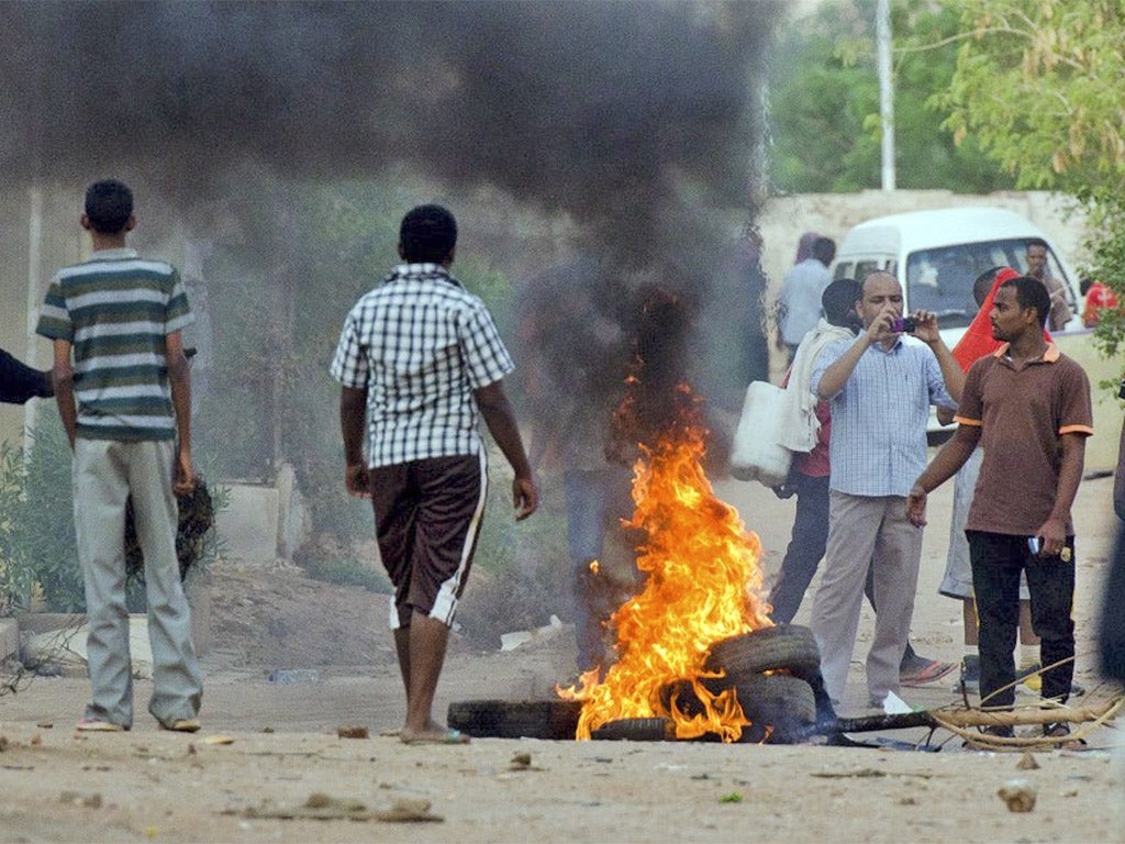 Tyres burn during protests in Khartoum last week. Bigger demonstrations are expected this weekend
