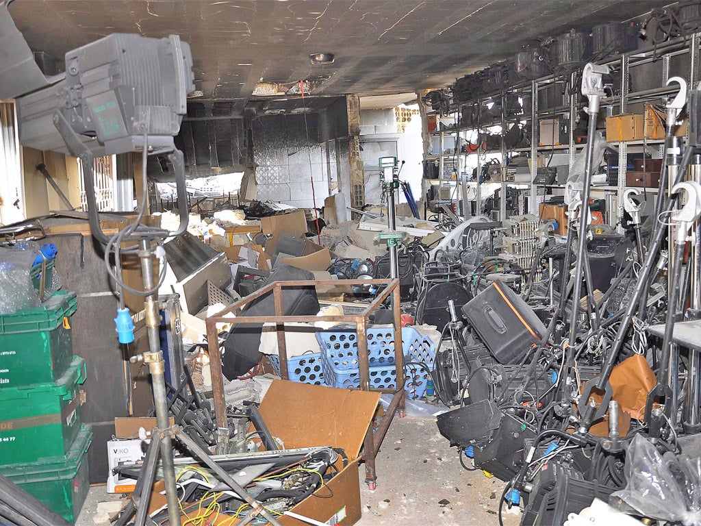 The bombed-out studios of al-Ikhbariya, a pro-government TV station, near Damascus yesterday