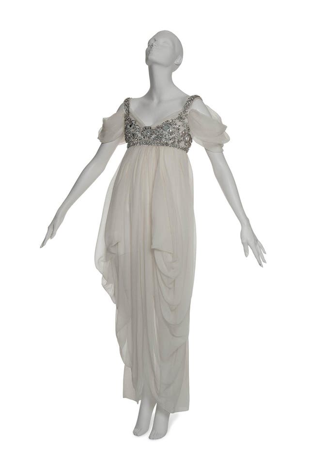 An ivory silk tulle empire line gown, designed by Alexander McQueen entitled The Girl Who Lived In The Tree. Chart star Lady Gaga is believed to have paid a world record price for the gown at an auction of items from the personal collection of Daphne Guinness which was sold at Christie's, London.