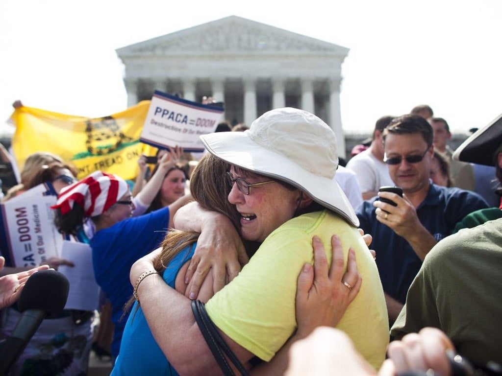 Protesters react to the Supreme Court's decision