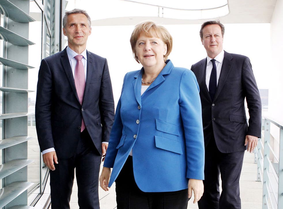 Together alone: Mr Cameron has
managed to alienate Ms Merkel