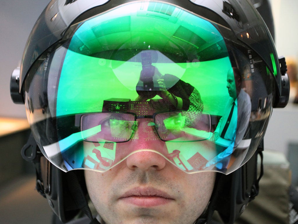 Mark Leftly tries on BAE's Striker helmet for size at the group's
electronic systems site in Rochester