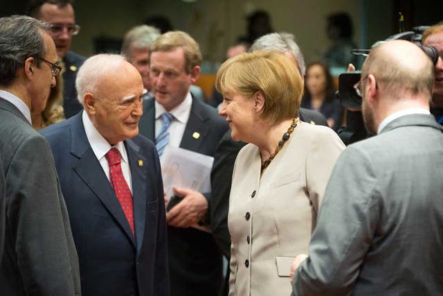 German Chancellor Angela Merkel and Greek President Karolos Papoulias (centre left) at the summit last night