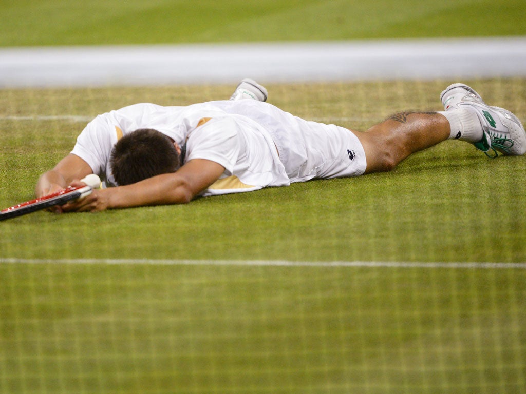 Lukas Rosol collapses at the end of his epic victory over Rafa Nadal