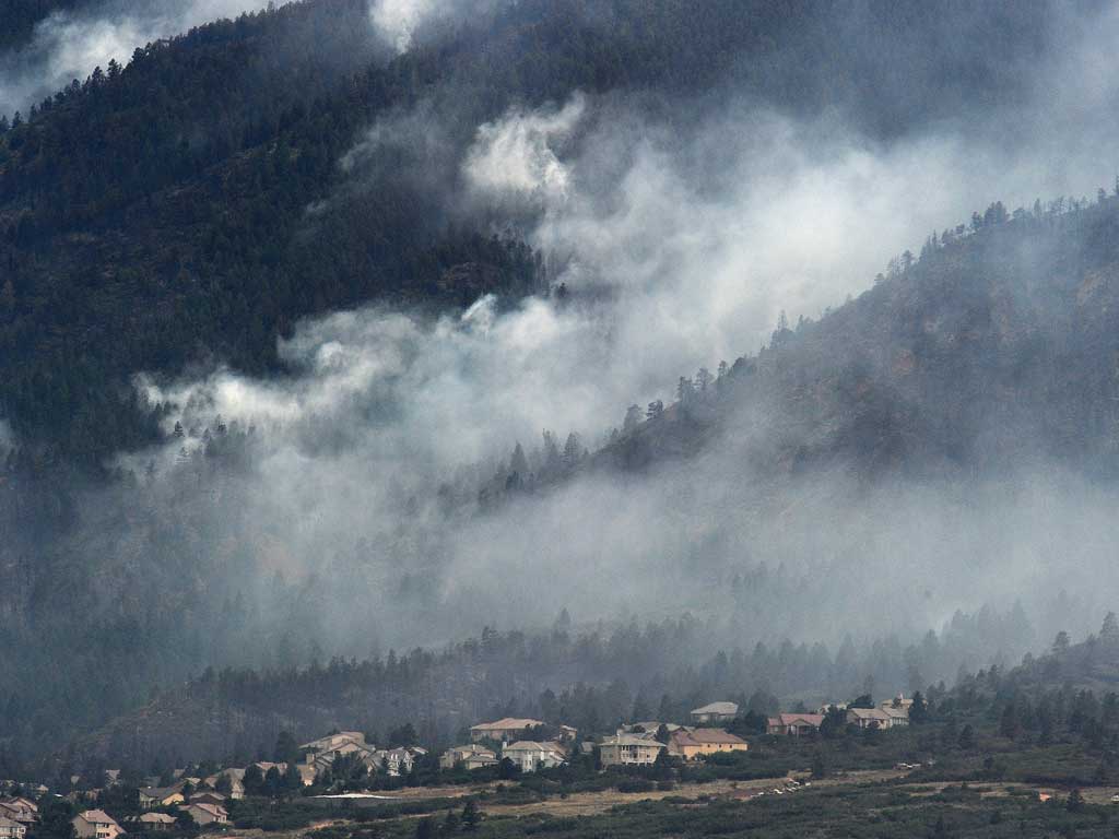 Smoke from the Waldo Canyon fire rises above evacuated homes in Colorado Springs
