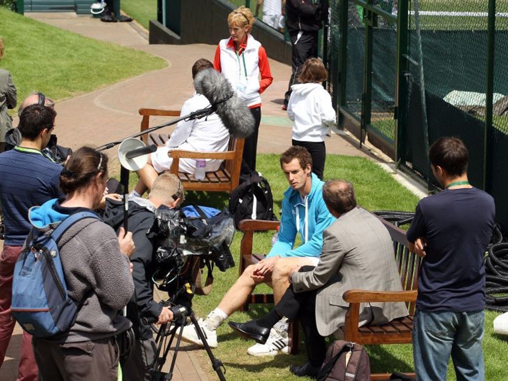 Andy Murray speaks to the media after practice at Wimbledon yesterday