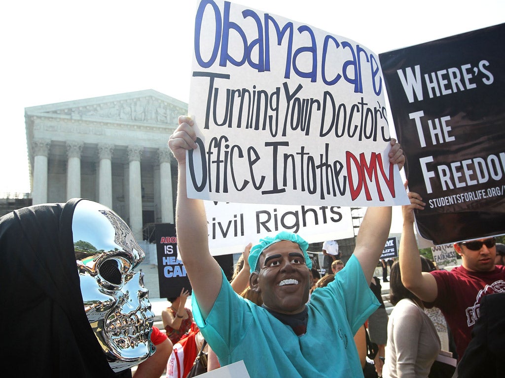 Anti-Obamacare protesters wearing Barack Obama and Grim Reaper masks, outside the Supreme Court