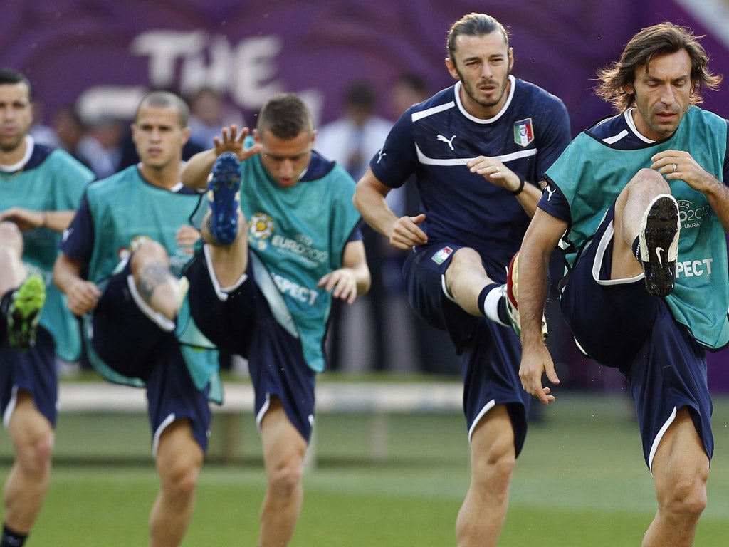 Best feet forward: Andrea Pirlo leads the Italian squad being put through their paces ahead of tonight's Euro 2012 final against Spain