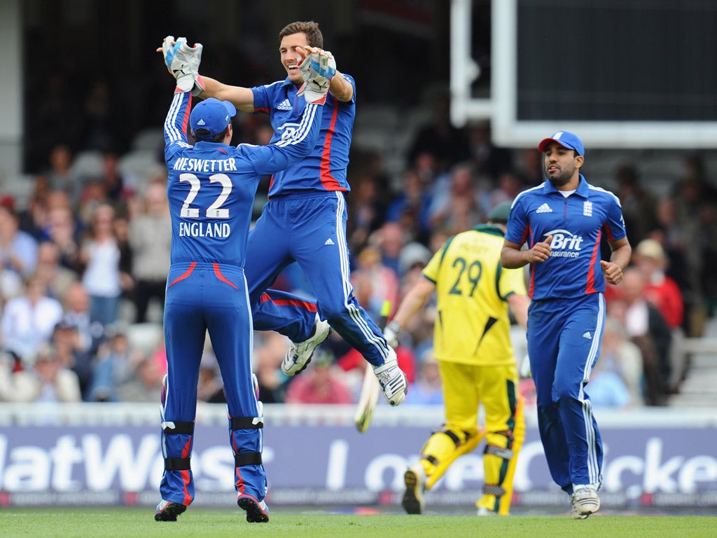 England's Steven Finn celebrates after spectacularly running out Australia's David Hussey