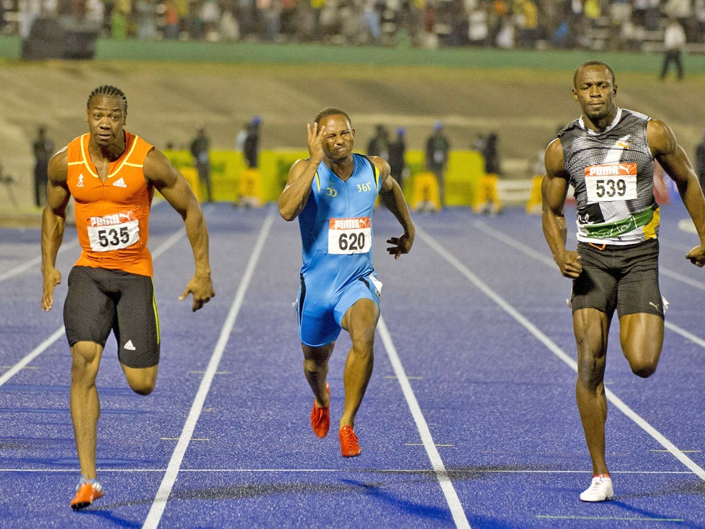 Yohan Blake (left) beats Usain Bolt (right) and Michael Frater to win the 100m final at the Jamaican Olympic trials in Kingston