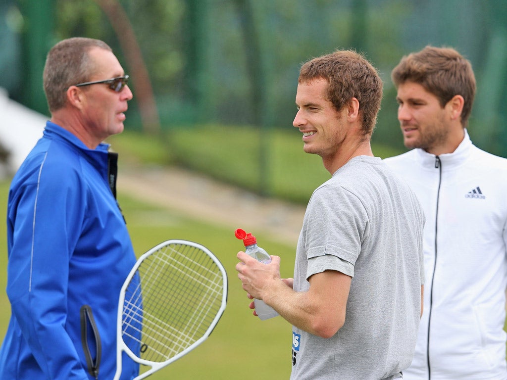 Andy Murray relaxes with coaches Ivan Lendl (left) and Danny
Vallverdu during a practice session at Wimbledon yesterday