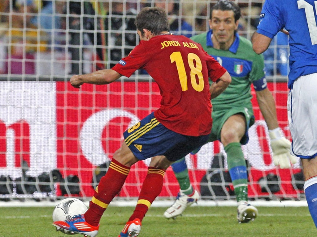 Spain left-back Jordi Alba slots the second past Gianluigi Buffon