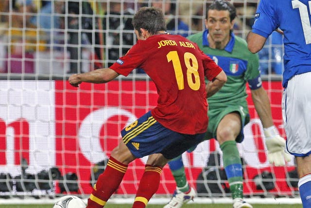 Spain left-back Jordi Alba slots the second past Gianluigi Buffon