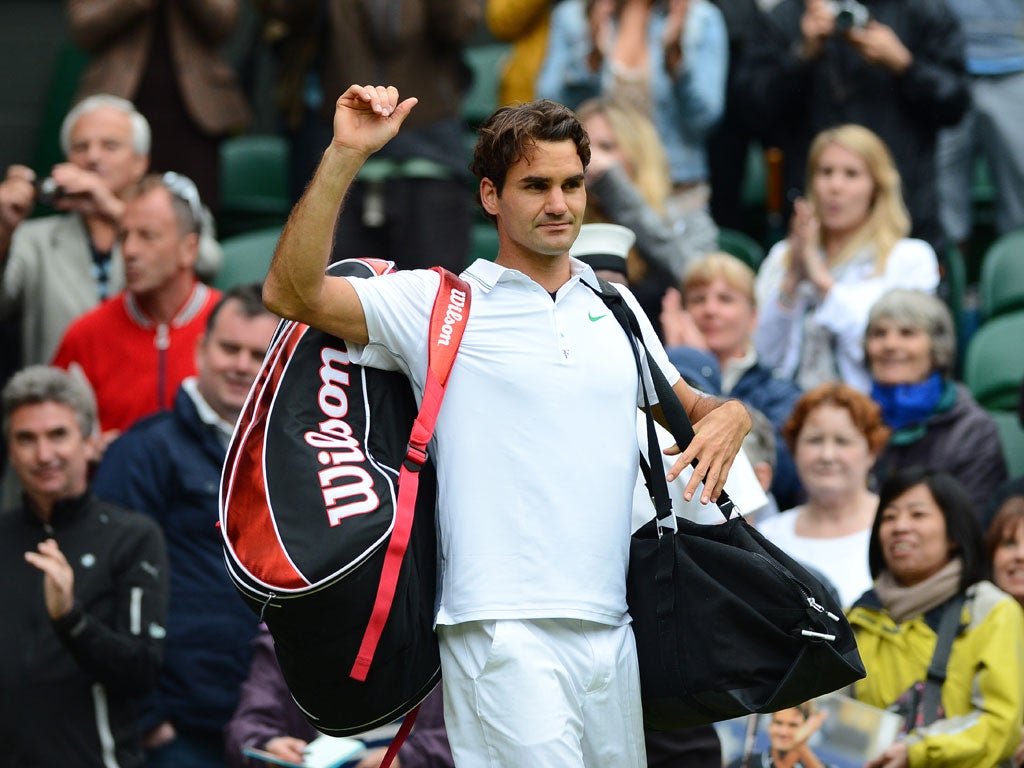 Federer celebrates victory on Centre Court