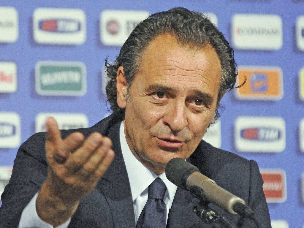 Coach Cesare Prandelli faces the press after Italy’s caning in Kiev
