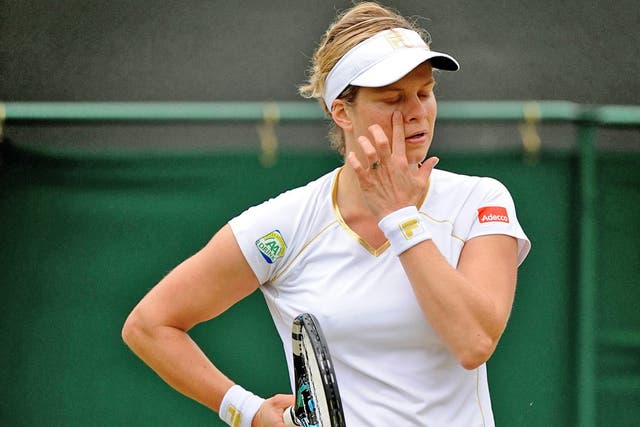 Kim Clijsters reacts to her defeat at the hands of Angelique Kerber