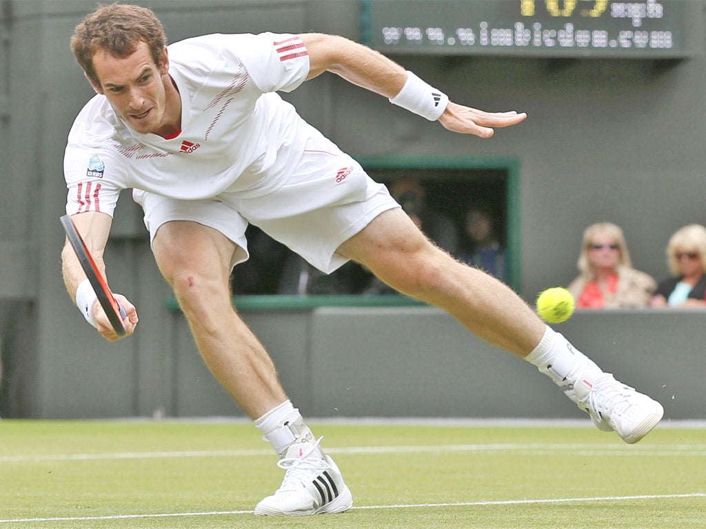 Andy Murray hits a return during his win over Marin Cilic
