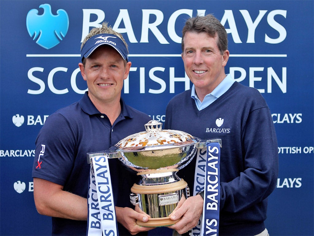 Bob Diamond presents golfer Luke Donald with a trophy for winning the Barclays sponsored Scottish Open