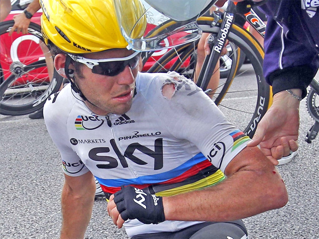 A cut and dazed Mark Cavendish prepares to remount in Rouen