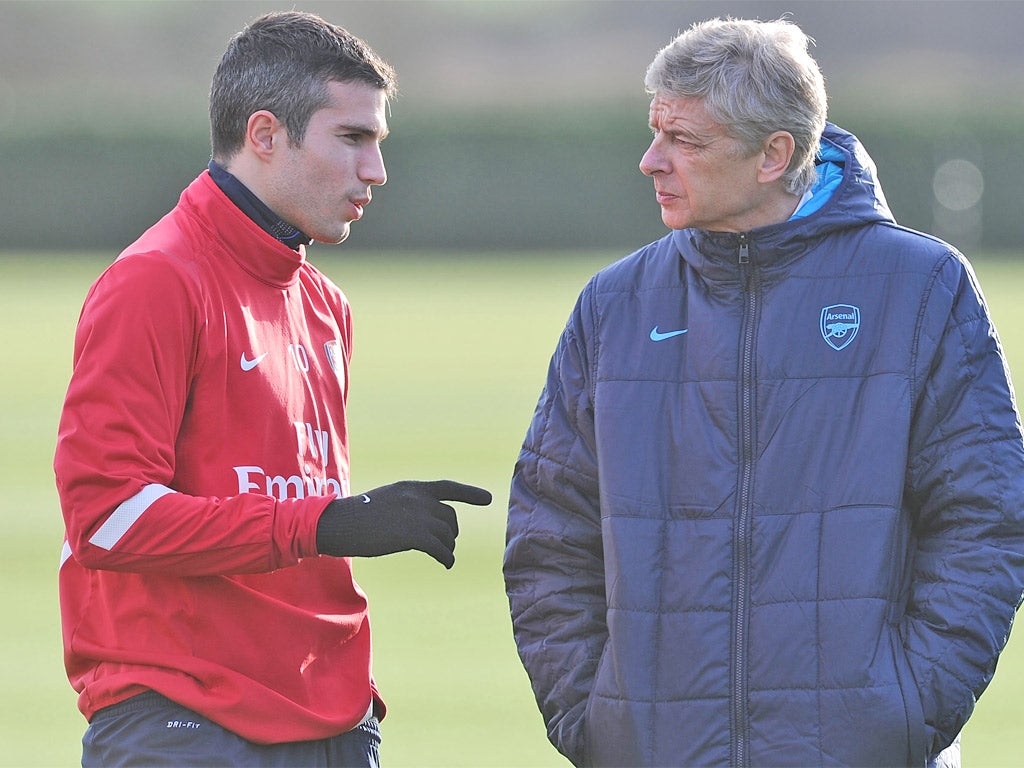 Robin van Persie and Arsene Wenger are on a different page