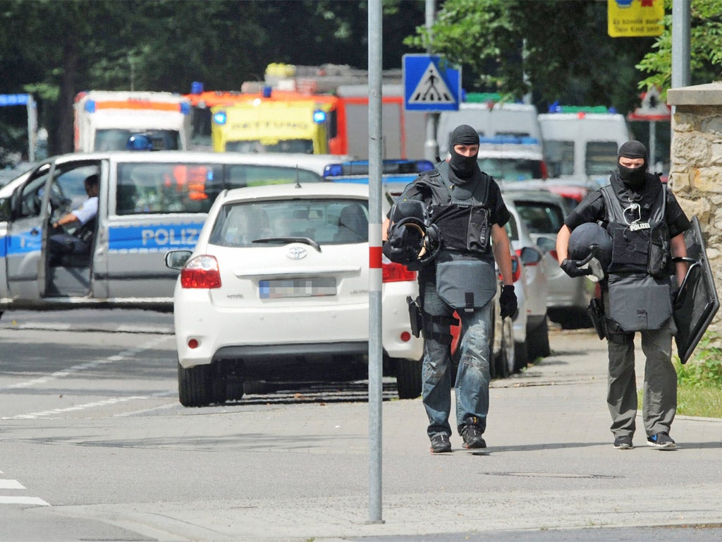 Police commandos outside the scene of the siege in Karlsruhe