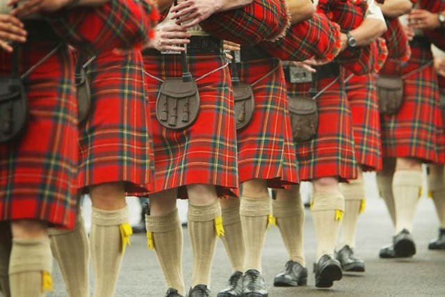 EDINBURGH, SCOTLAND - AUGUST 4: Scottish pipers take to the parade ground at Redford Barracks on August 4, 2004 in Edinburgh, Scotland. Military Bands and performers from around the world braved the Scottish rain and gathered for a final rehearsal of the forthcoming 55th Edinburgh Military Tattoo.