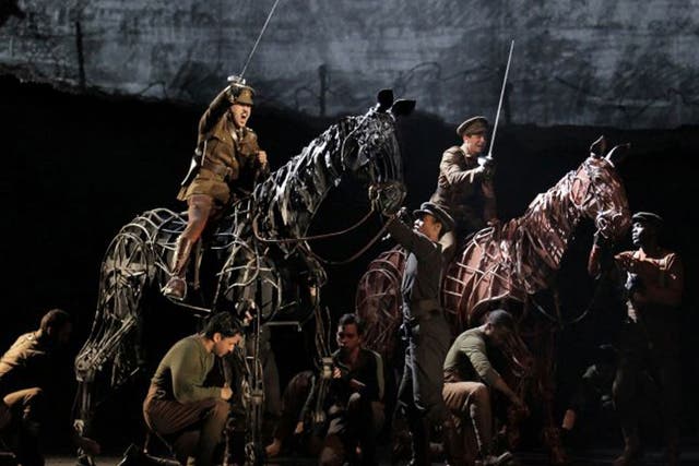 FILE - In this file theater publicity image provided by Lincoln Center Theater, a scene is shown from the production of "War Horse," performing at the Lincoln Center Theater in New York. "War Horse" was the No. 2 movie in 2011.