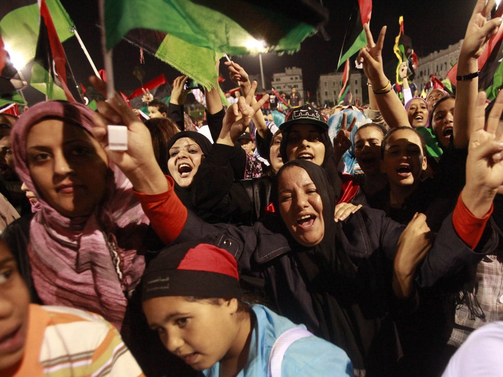 Libyans celebrate the death of
Gaddafi