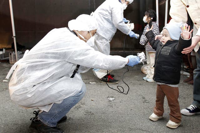 Checking for radiation near the Fukushima
plant two days after the tsunami struck