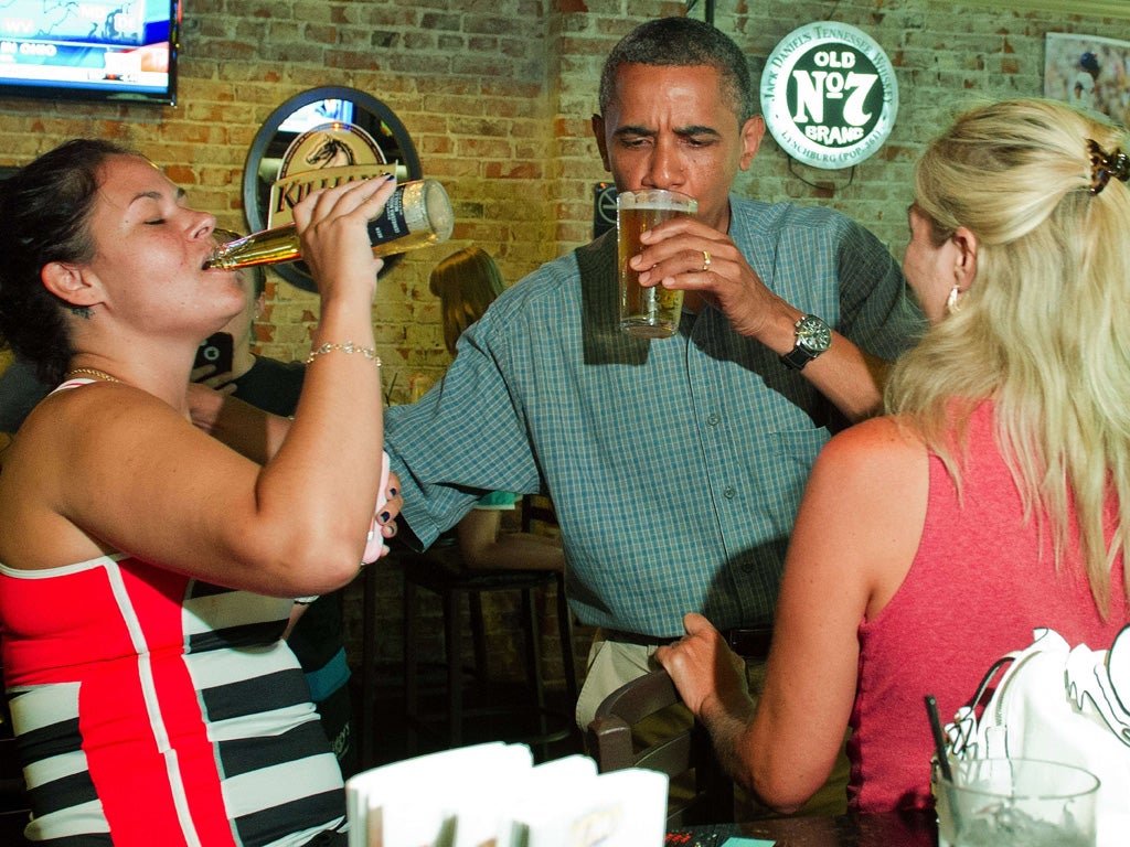 President Barack Obama enjoys a beer with potential voters in the
must-win state of Ohio