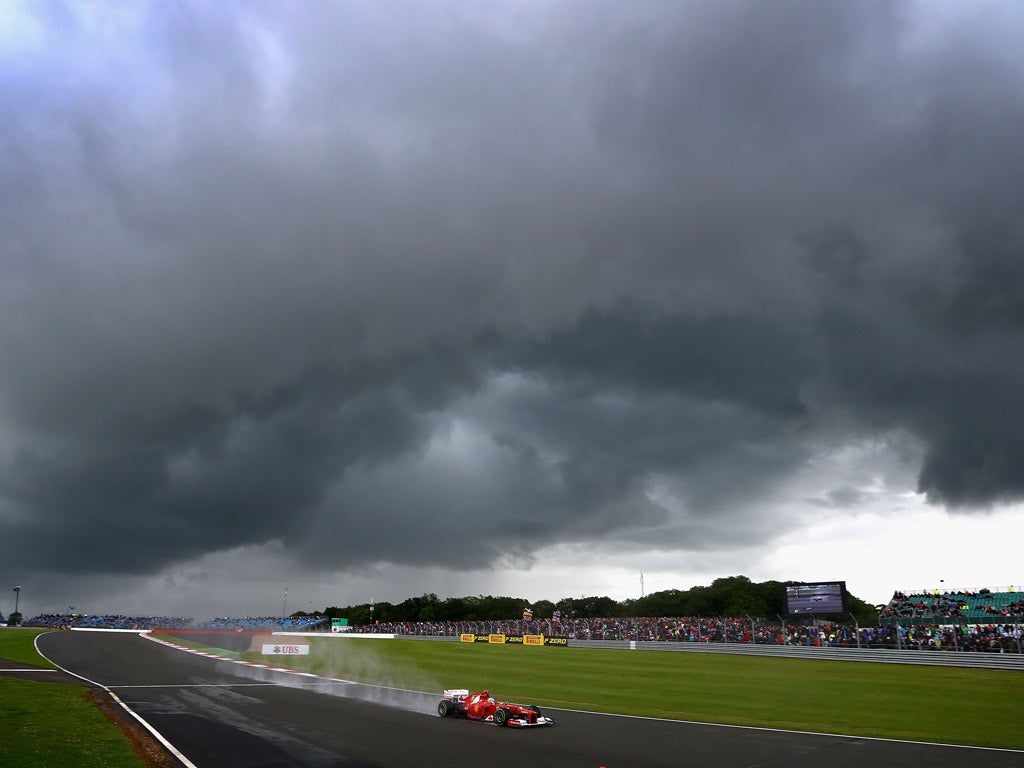 Alonso drives on his way to finishing under stormy skies at Silverstone