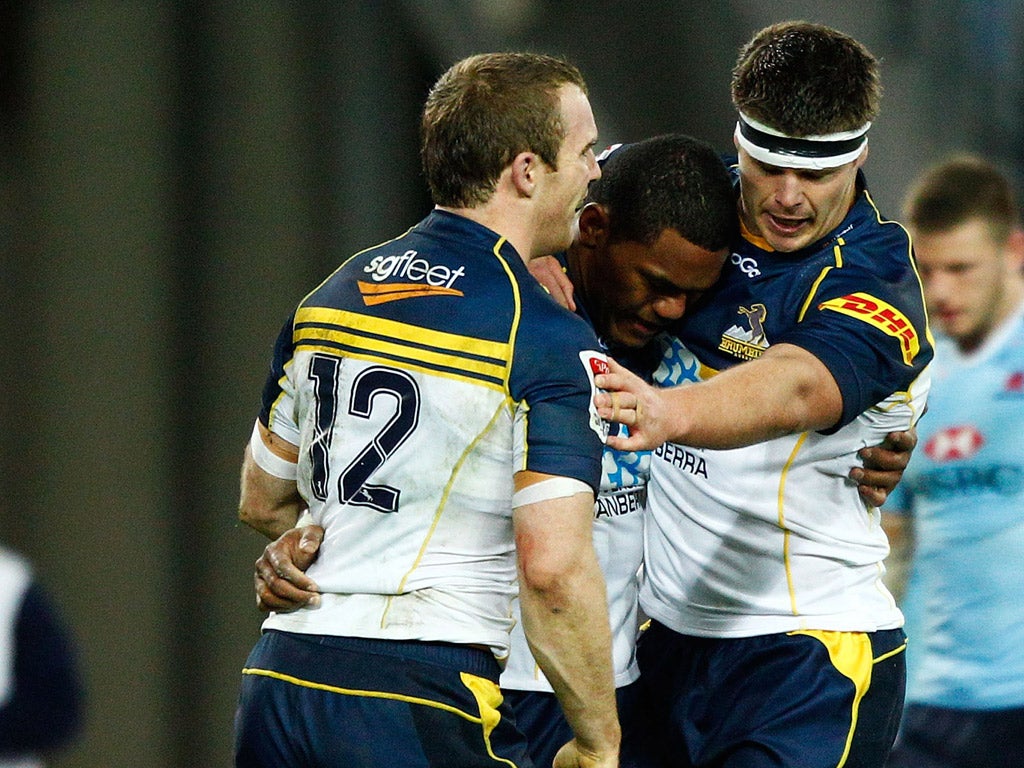 Winning feeling: Brumbies wing Henry Speight is congratulated