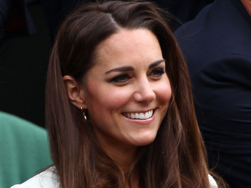 Catherine, Duchess of Cambridge sits in the Royal Box during the Gentlemen's Singles final match between Roger Federer of Switzerland and Andy Murray of Great Britain