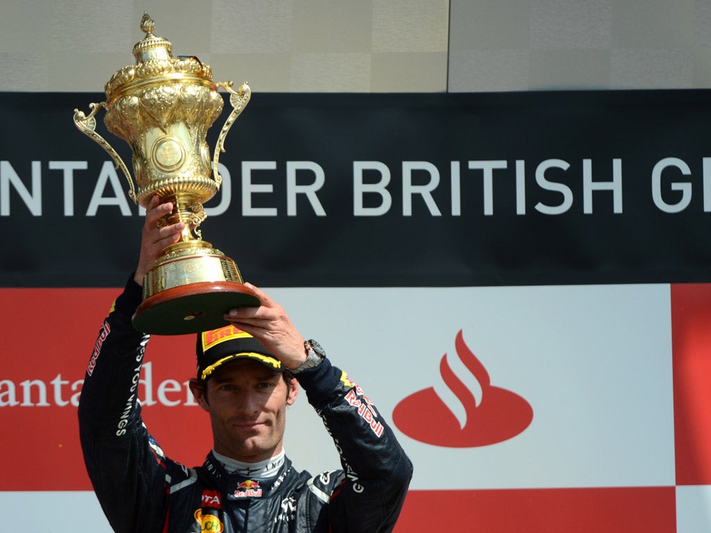 Marc Webber celebrates on the podium after winning the British Grand Prix