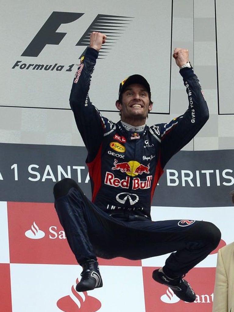 Mark Webber celebrates winning at Silverstone