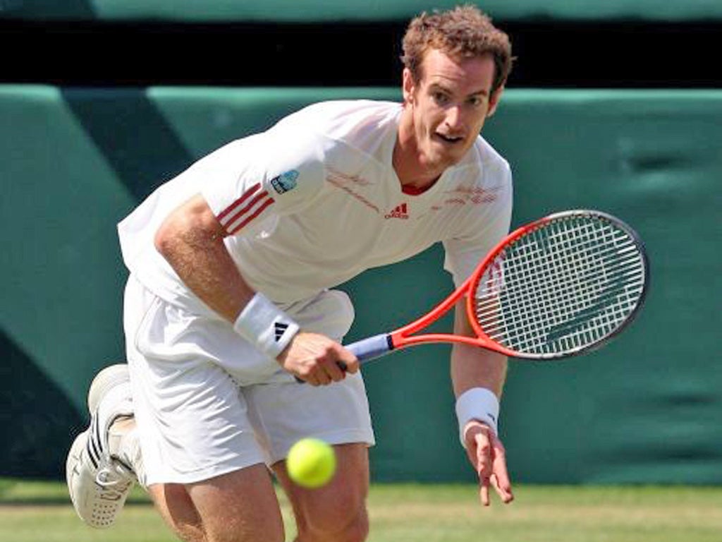 Andy Murray races to make a return against Roger Federer yesterday