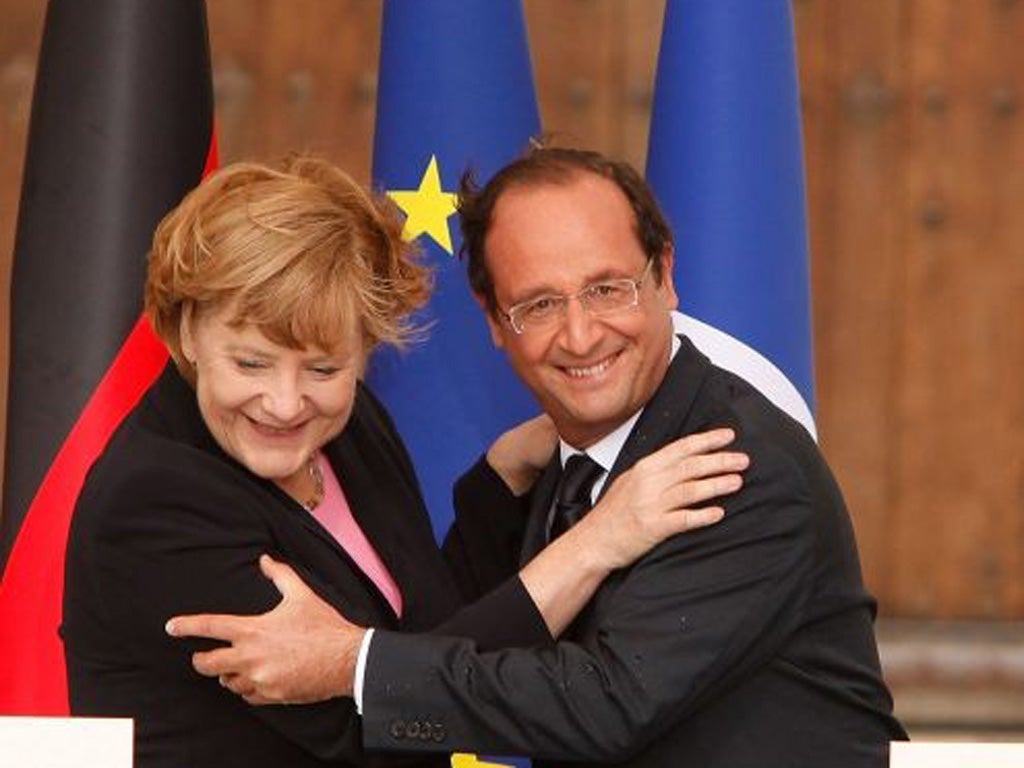 President Francois Hollande and German Chancellor Angela
Merkel joined in a celebration of unity on Sunday