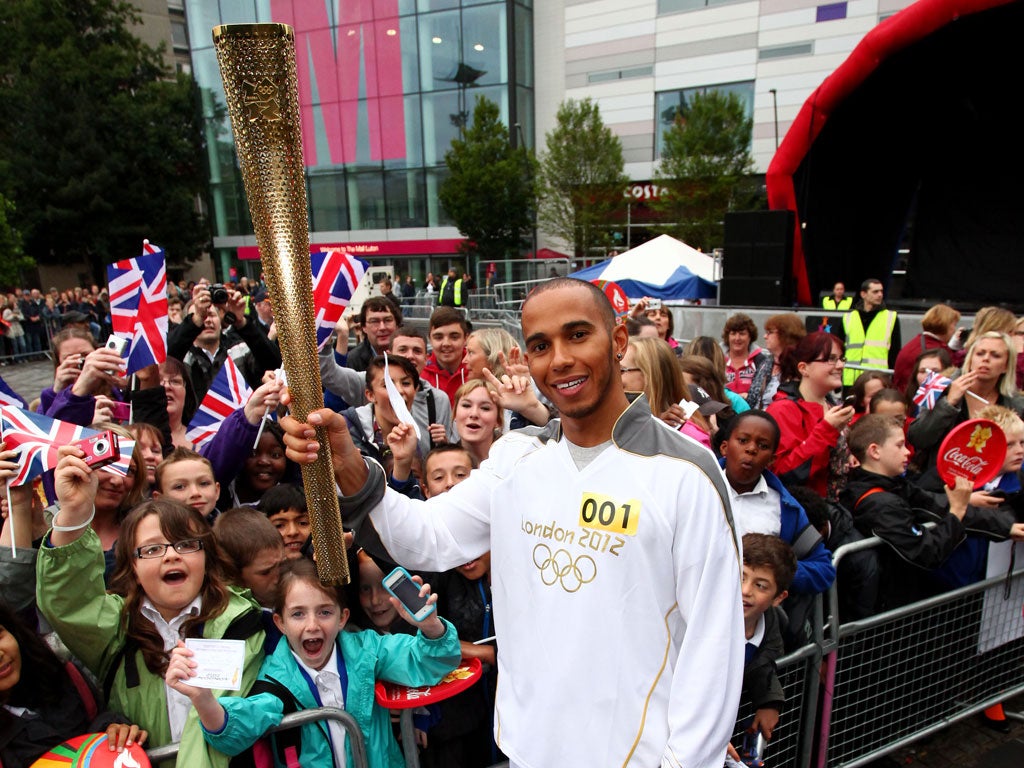 Lewis Hamilton with the Olympic torch