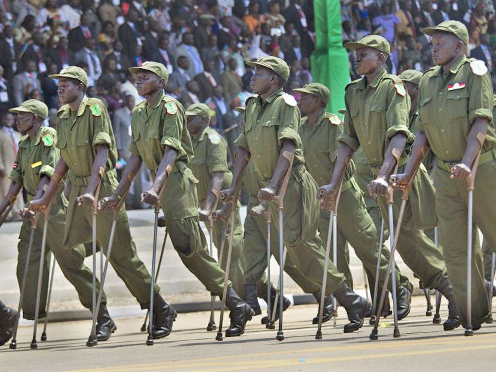 Military veterans parade during an Independence day ceremony in Juba yesterday