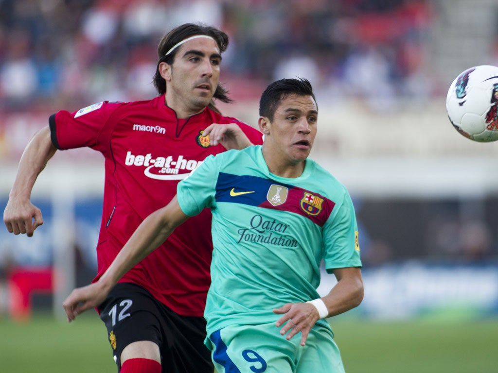 Jose Manuel Flores (left) in action against Barcelona