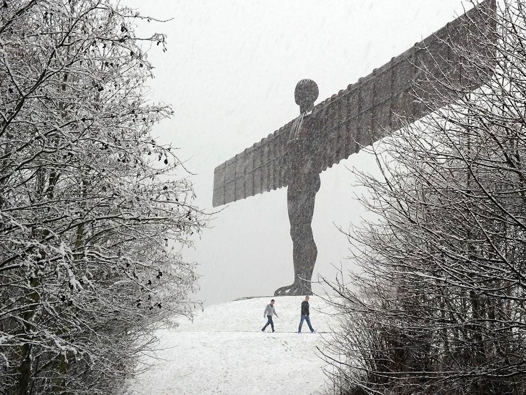 The Angel of the North statue is covered in heavy snow as a bitter chill swept across Britain in December 2011