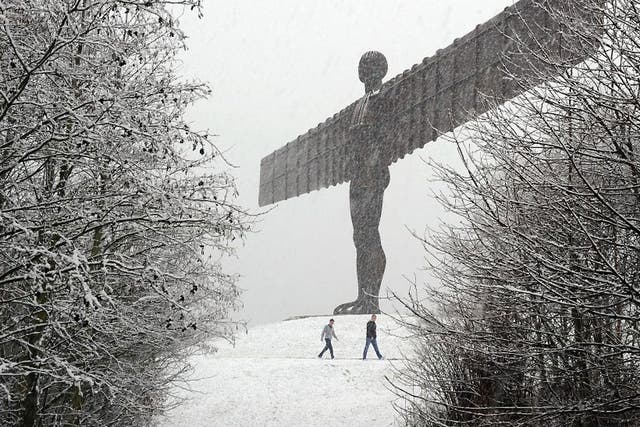 The Angel of the North statue is covered in heavy snow as a bitter chill swept across Britain in December 2011