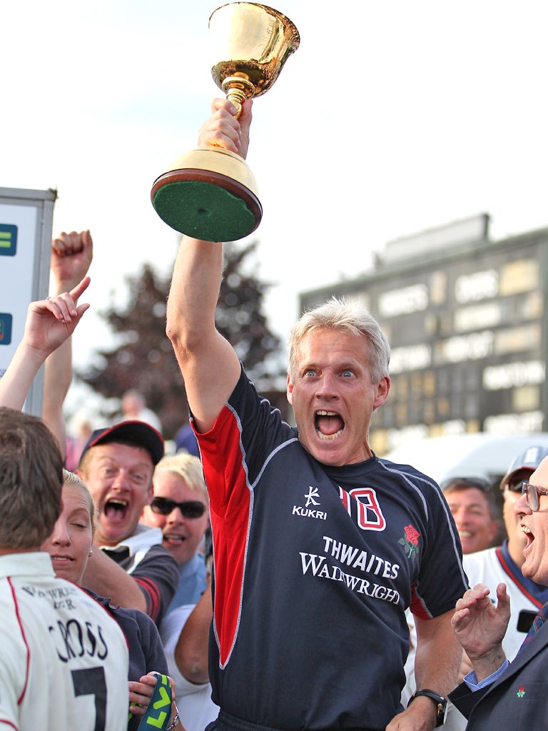 Peter Moores celebrates Lancashire's County Championship triumph in 2011