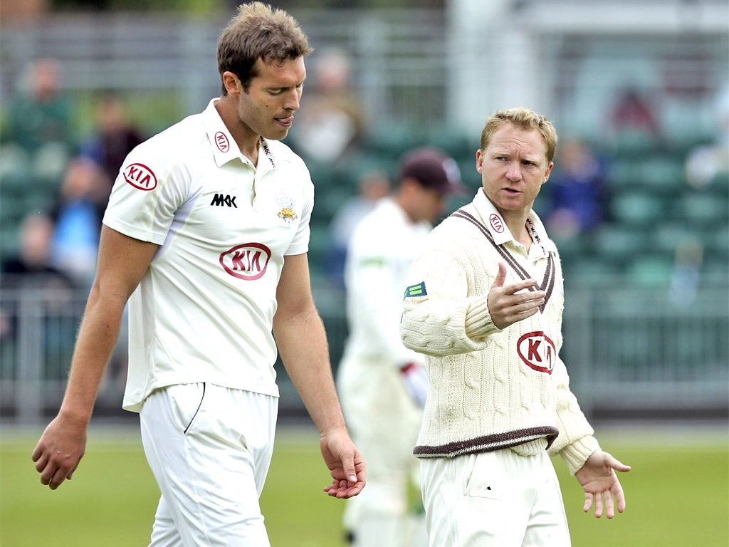Chris Tremlett receives some words of advise from his Surrey captain Gareth Batty