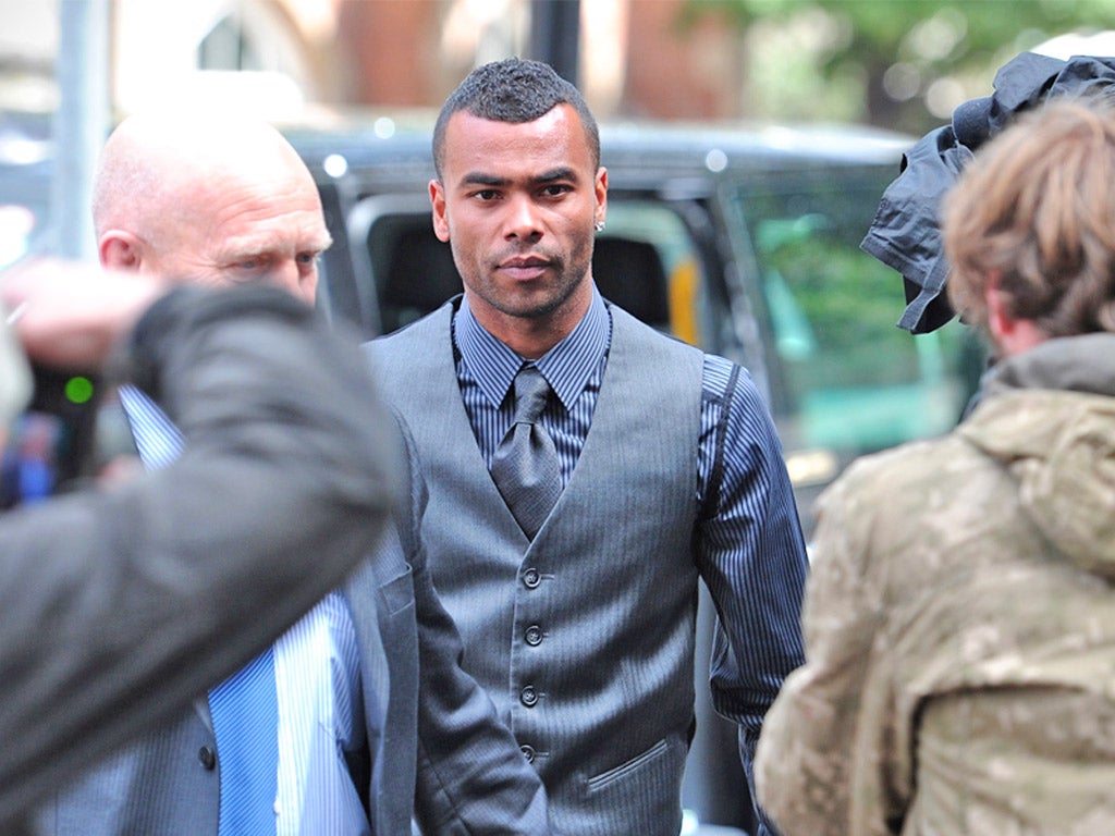 Ashley Cole is the centre of attention as he arrives at the trial yesterday